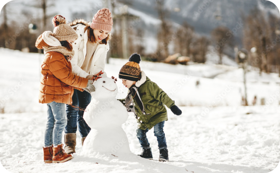 Image of a family building a snowman